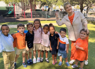 Crossing Borders: A Houston School that is Set Apart Teacher stands outside with preschool students