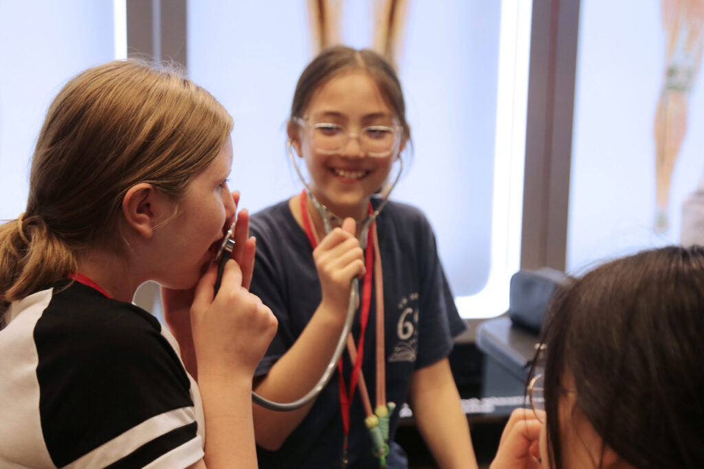 girls playing with stethoscope