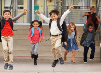 Explore Houston Area School Choice Options All in One Place kids jumping in front of school