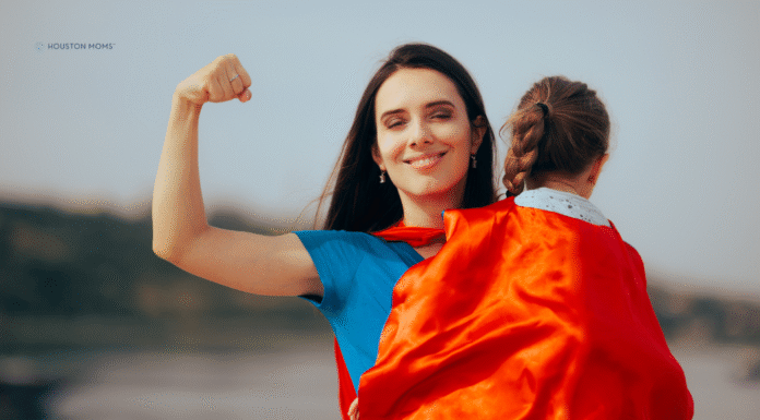 Please Don’t Call Me Supermom Mom holds child in cape