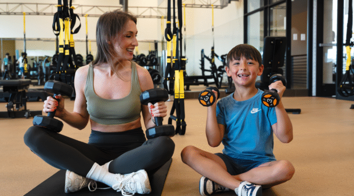 Discover Your Ideal Houston Wellness Experience mom and son lifting weights on floor of Villa Sport