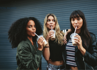 three women sipping drinks