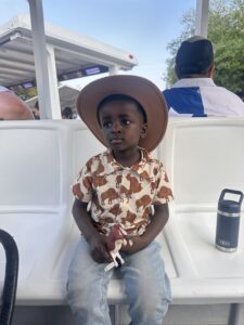 Child in rodeo wear and cowboy hat