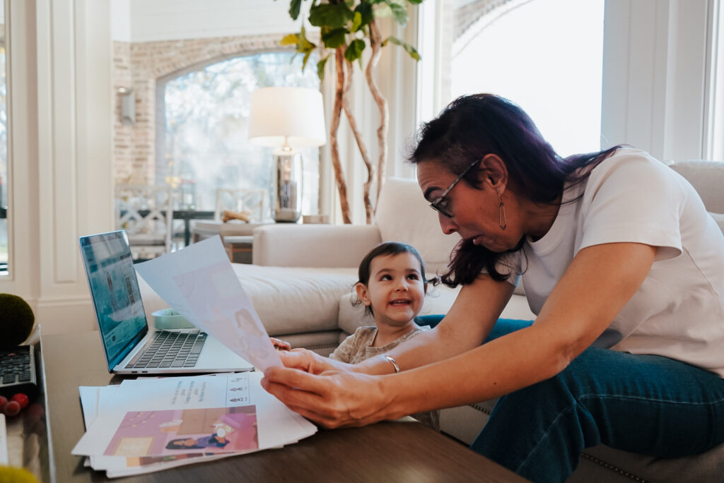 mother and small child looking at papers