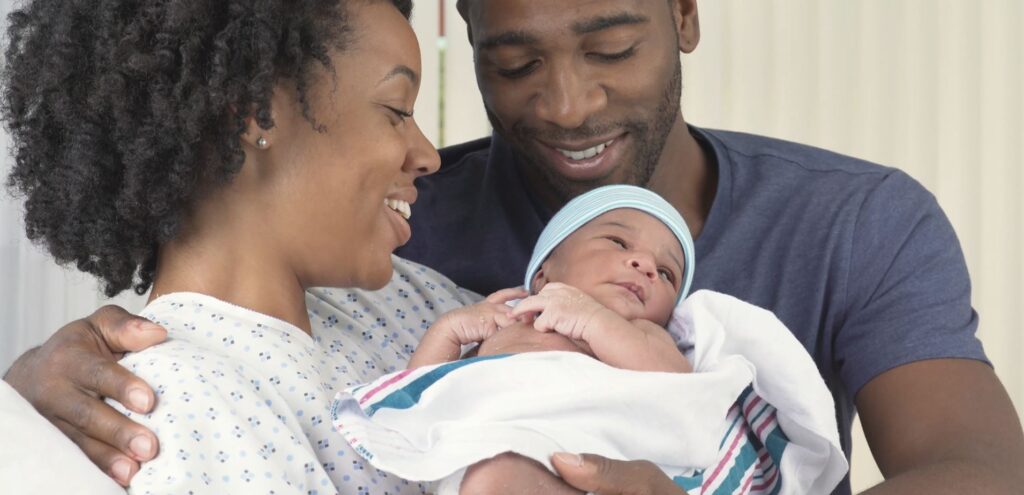 couple holding newborn