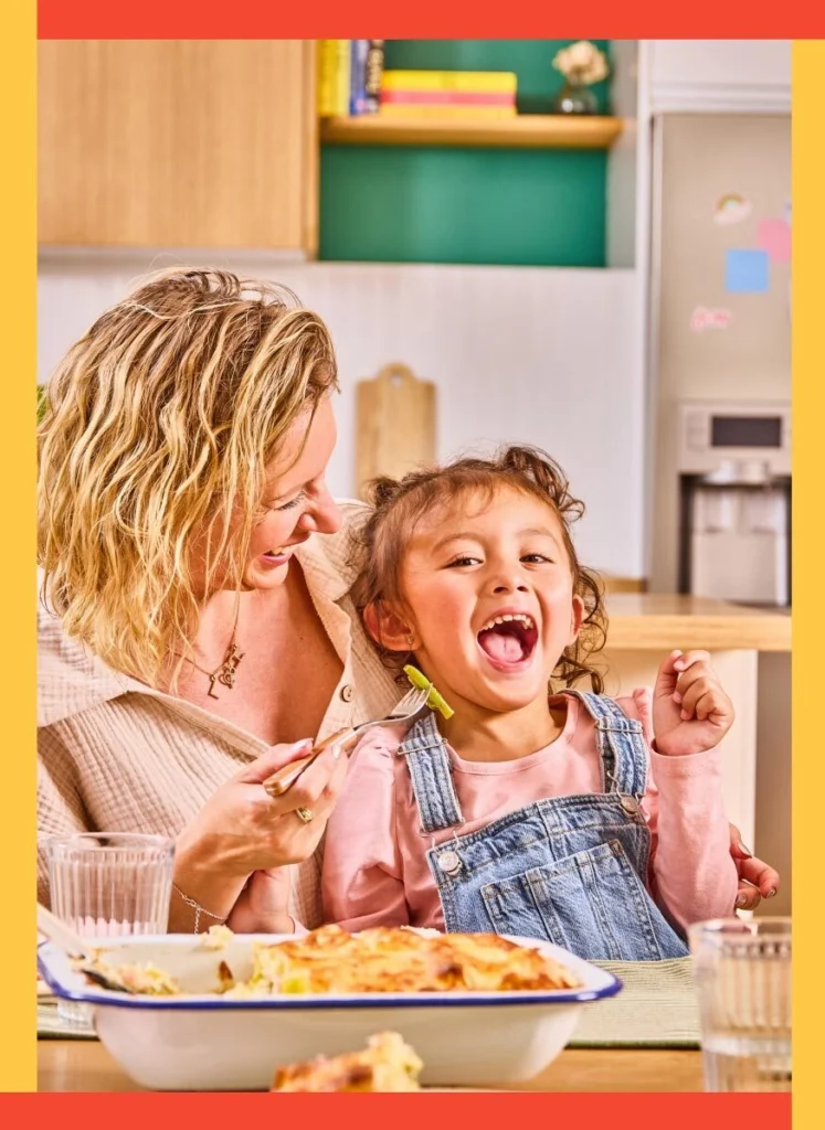 mom and daughter sharing meal