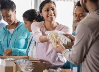 woman handing out food