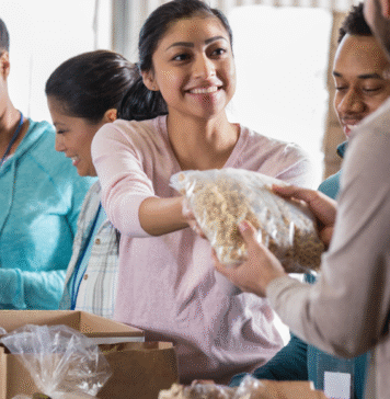 woman handing out food