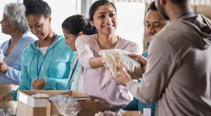 Small Acts With Big Impact: Happy Volunteer Month! woman handing out food