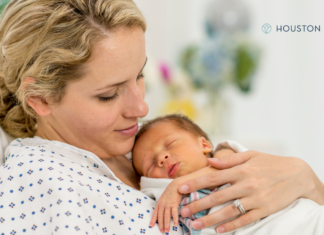 woman holds infant just born
