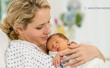 woman holds infant just born
