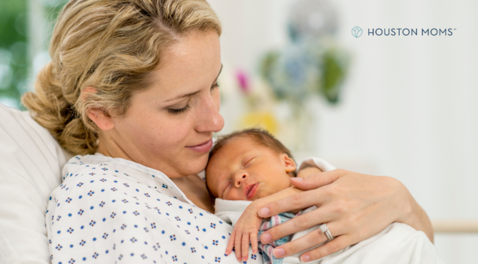Becoming A Mother: A Reflection for Mother’s Day woman holds infant just born
