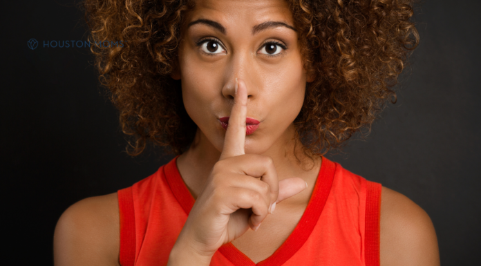 The Consequences of Pregnancy: The Quiet Part Out Loud woman holding finger to her mouth indicating quiet