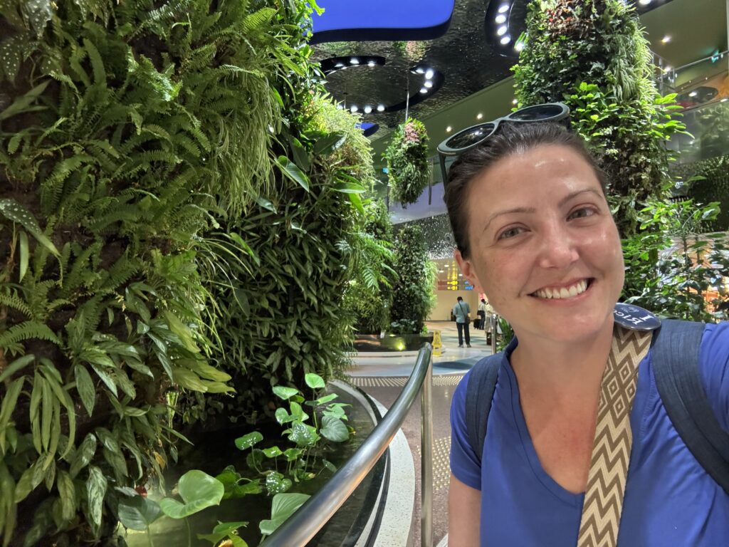 The author pictured in one of the gardens of Changi Airport in Singapore