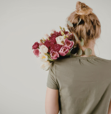 woman holding a bouquet of flowers