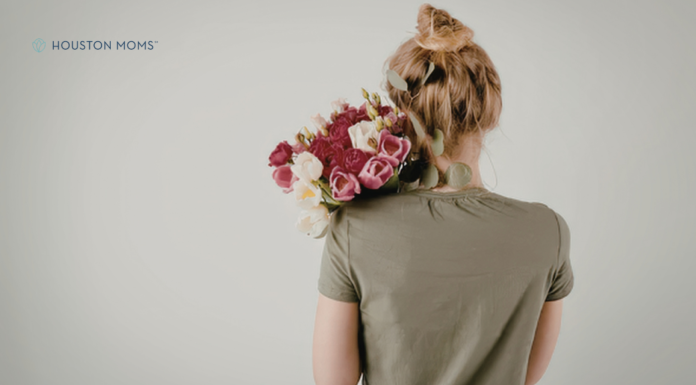 Mother’s Day: It Can Feel Complicated woman holding a bouquet of flowers