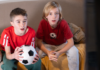 The Ultimate Guide to Soccer Watch Parties & Events in Houston Soccer watch parties with two boys watching soccer