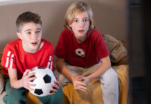 Soccer watch parties with two boys watching soccer
