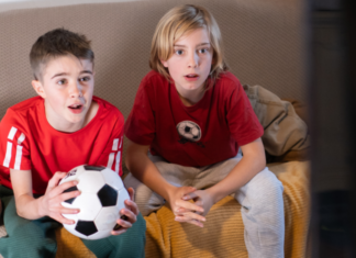 The Ultimate Guide to Soccer Watch Parties & Events in Houston Soccer watch parties with two boys watching soccer