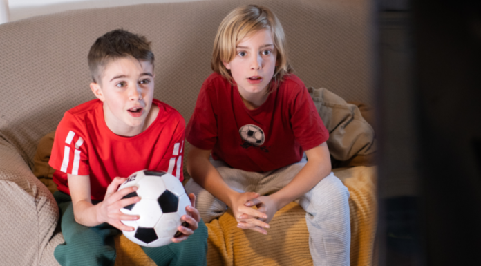 Soccer watch parties with two boys watching soccer