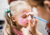 Child getting her face painted