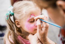 Child getting her face painted