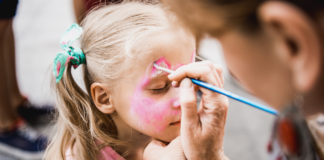 Child getting her face painted