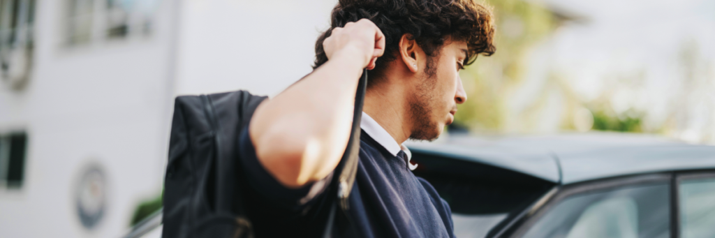 Stock image of teen at school dropoff