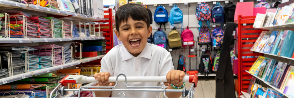 Stock image of child shopping for school supplies
