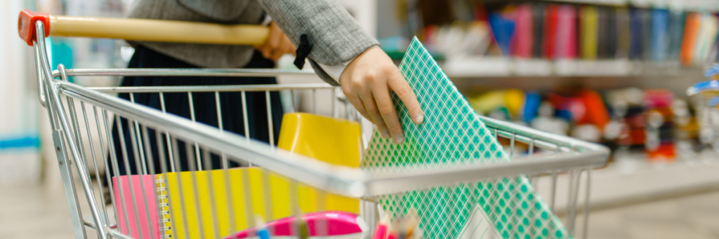 Stock image of child shopping for school supplies